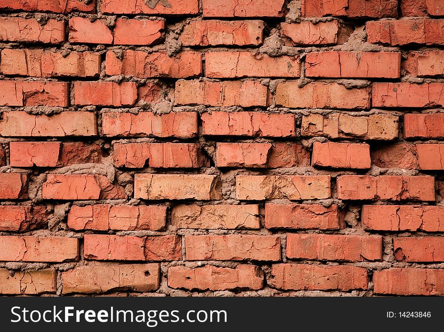 Grungy cracked old red brick texture, natural light. Grungy cracked old red brick texture, natural light