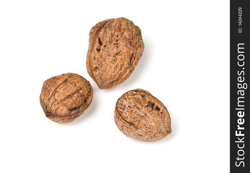 Raw walnuts isolated against white background. Raw walnuts isolated against white background