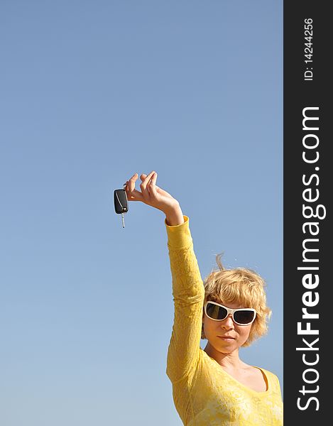Woman With Keys And White Sunglasses