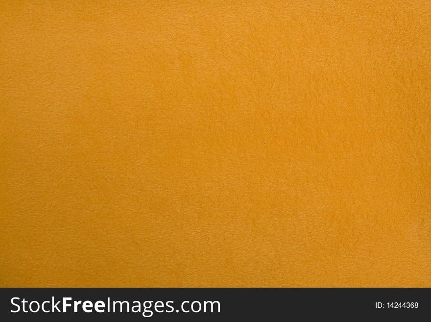 Fleece as a background. Yellow background.