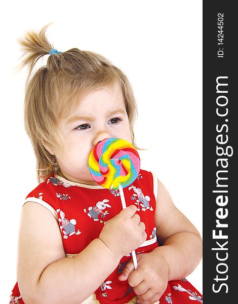 Funny baby girl with colorful lollipop. Funny baby girl with colorful lollipop