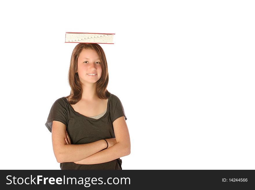 Teen girl balancing a book on her head on an isolated background