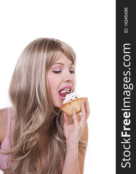 Beautiful girl eating cake on a white background. Beautiful girl eating cake on a white background