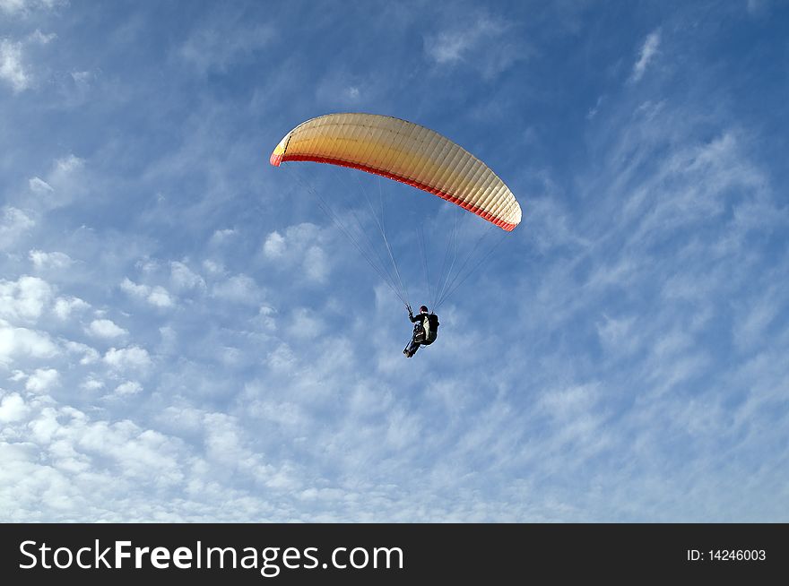Paraglider float in the air on background of blue sky. Paraglider float in the air on background of blue sky