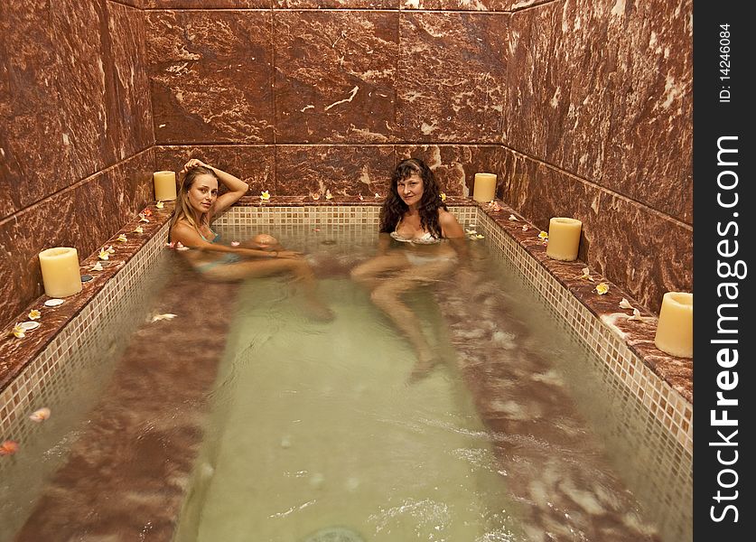 Two young girls in a jacuzzi at a health spa. Two young girls in a jacuzzi at a health spa