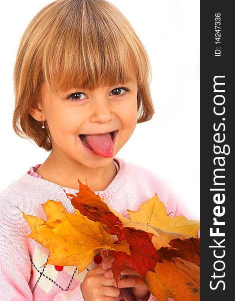 Little showing tongue girl with maple leaves against white background. Little showing tongue girl with maple leaves against white background