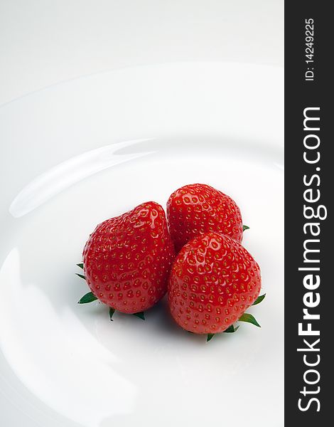 Strawberry on a white plate