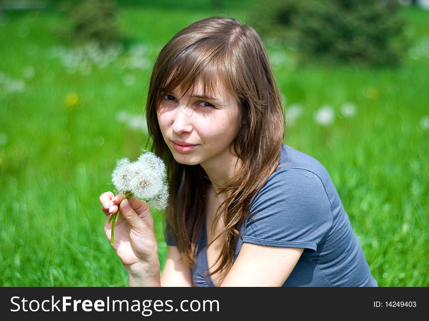 Teen girl with dandelions