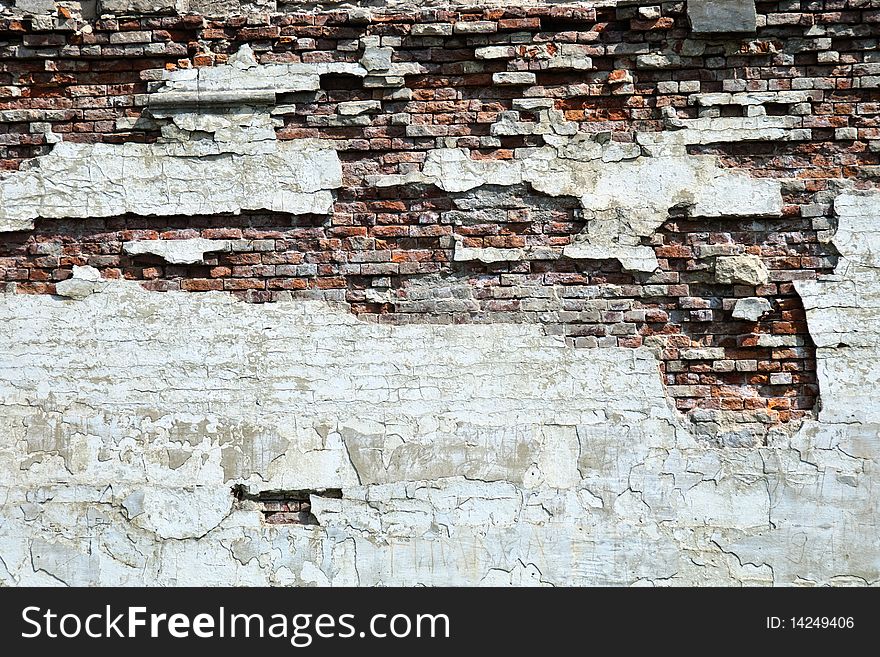 A broken brick wall - grunge background