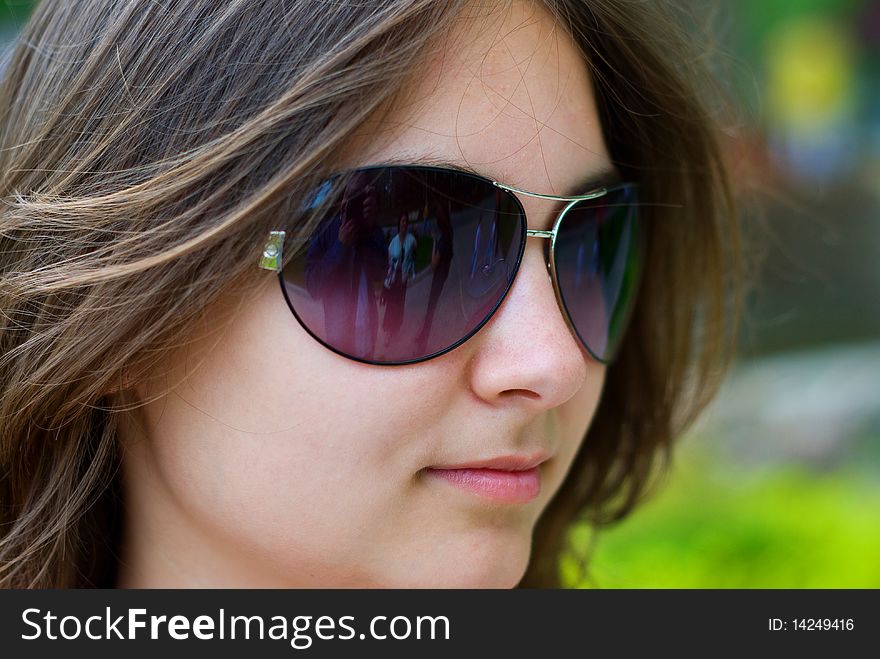 Portrait of a beautiful teenage girl in sunglasses. Portrait of a beautiful teenage girl in sunglasses