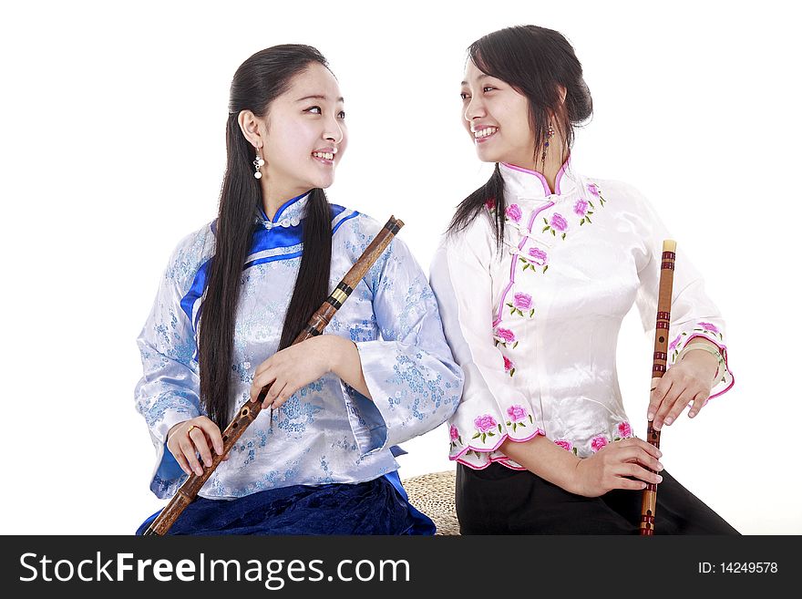 Two Chinese musicians with bamboo flute chatting on white. Two Chinese musicians with bamboo flute chatting on white.