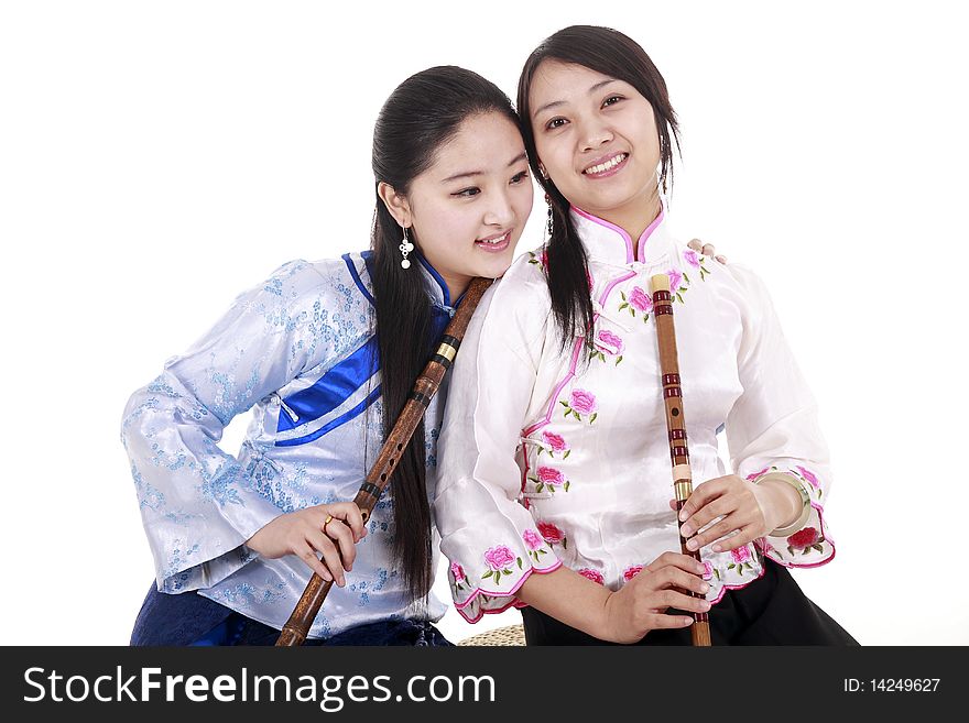 Two Chinese musicians with bamboo flute smiling on white. Two Chinese musicians with bamboo flute smiling on white.