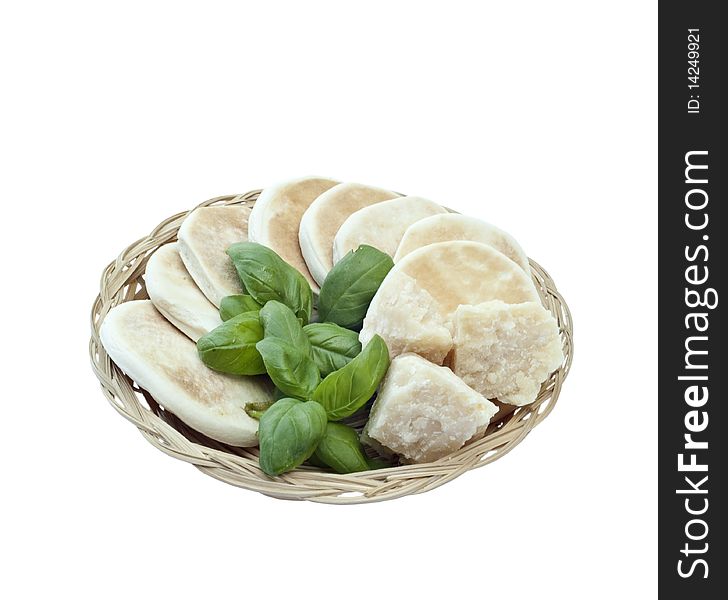 Small basket with bread, basil and parmesan