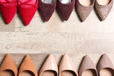 Free Stylish High Heeled Shoes On Wooden Floor, Flat Lay Stock Photo - 142458610