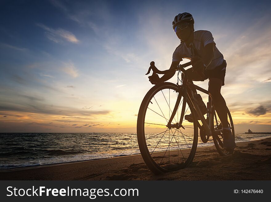 Cycling concept outdoors against sunset