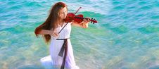 Young Woman Playing Violin In Water Stock Image Young Woman Playing Violin In Water Stock Image
