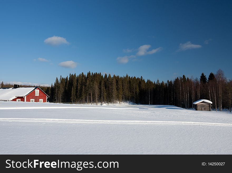 Small wooden house in winter.