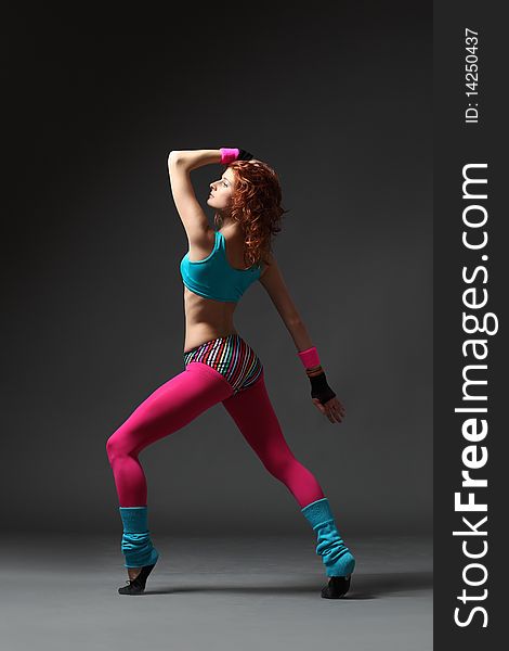 Modern style dancer posing on studio background. Modern style dancer posing on studio background