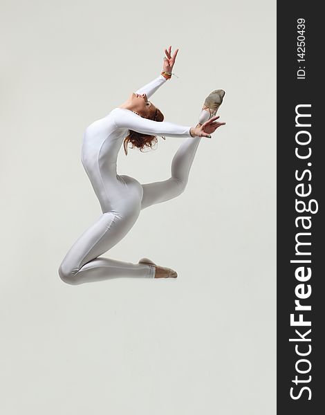 Modern style dancer posing on studio background. Modern style dancer posing on studio background