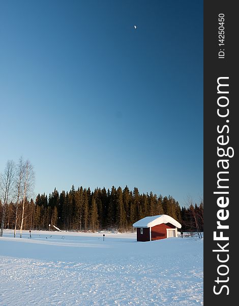 Small wooden house in winter. Finland.