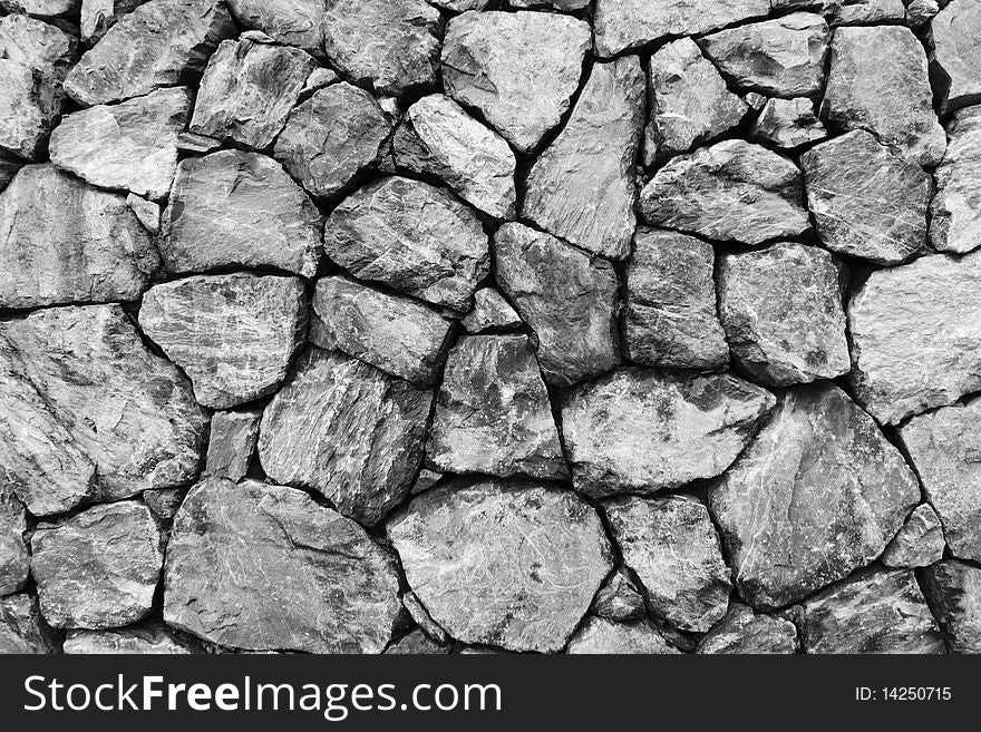 A wall made of stones ideal as a background. A wall made of stones ideal as a background.