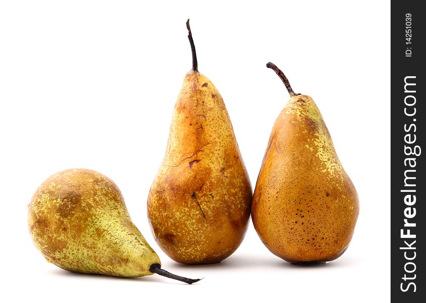 Three ripe pears on white background
