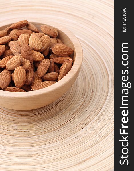 Almonds in wooden bowl. Nuts. Almonds in wooden bowl. Nuts