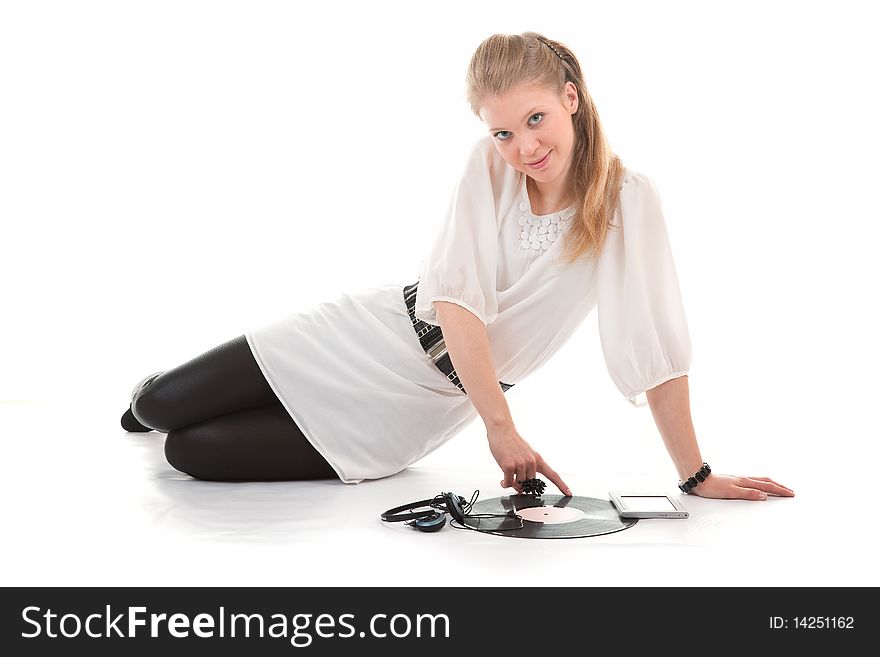 Young girl with a vinyl record and headphones. Young girl with a vinyl record and headphones