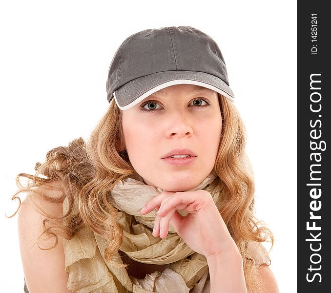 Young girl with a baseball cap on white