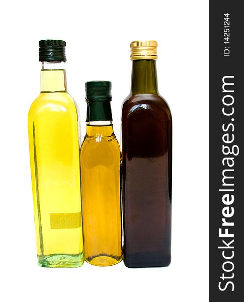 Three colored glass bottles on a white background. Three colored glass bottles on a white background