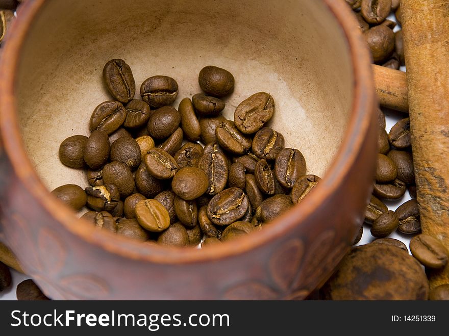 Coffee beans in cup close-up
