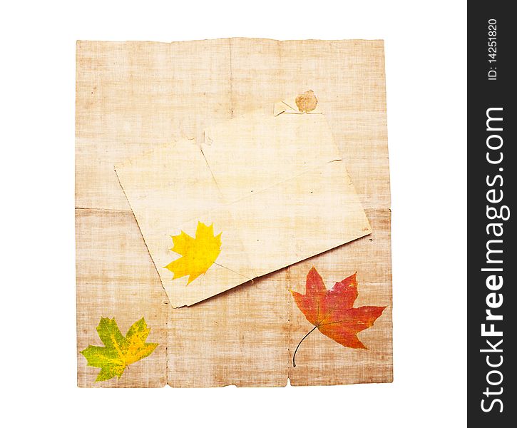 Abstract background in the form of an old dirty paper with autumn leaves