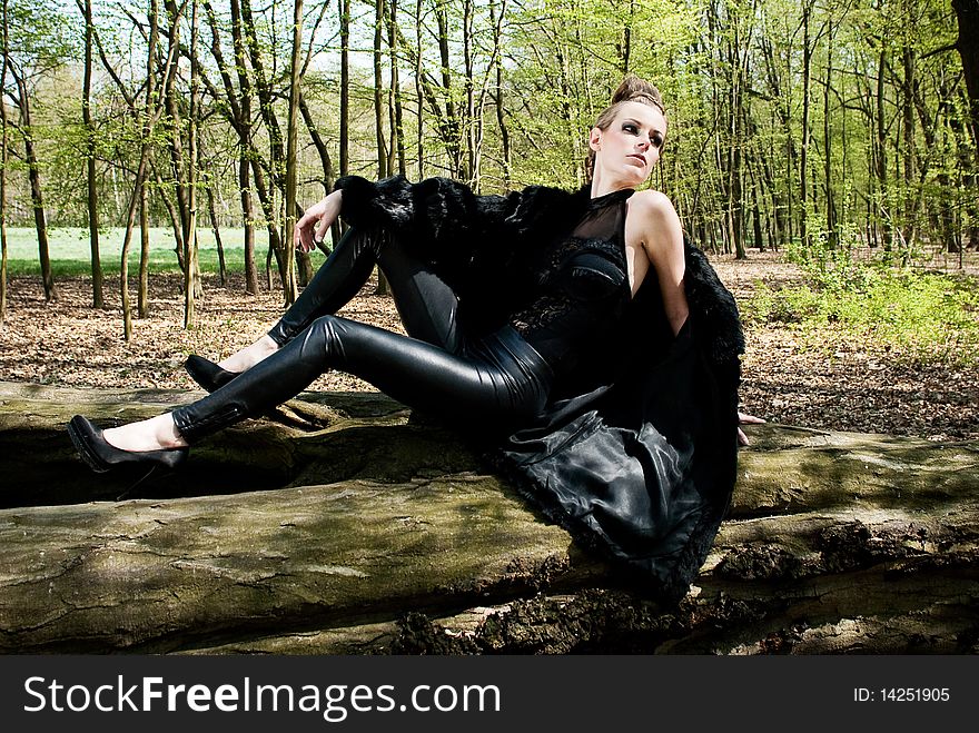 Portrait of beautiful fashion young woman and man in outdoor setting