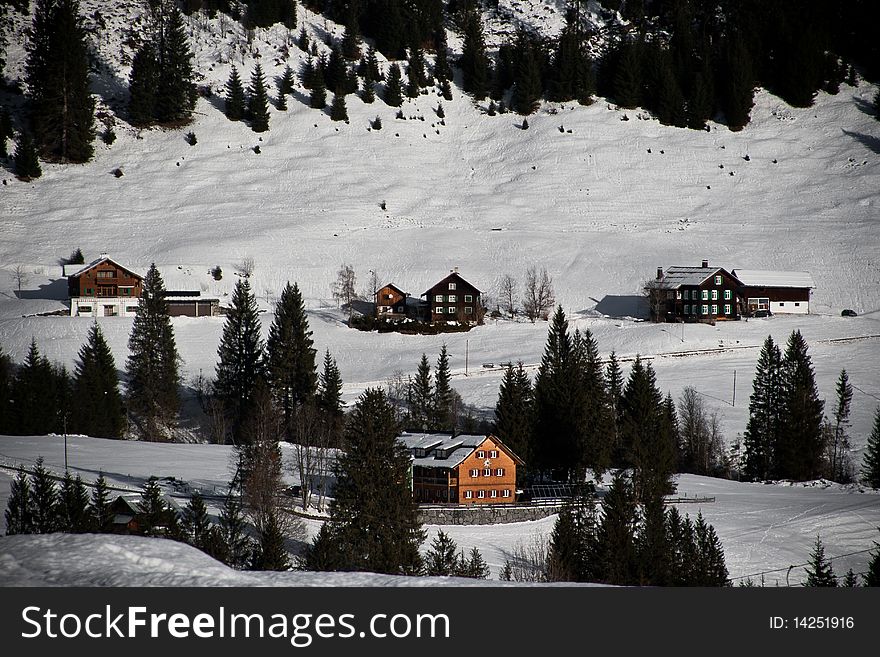 Some huts in a snow landscape in austria. Some huts in a snow landscape in austria.