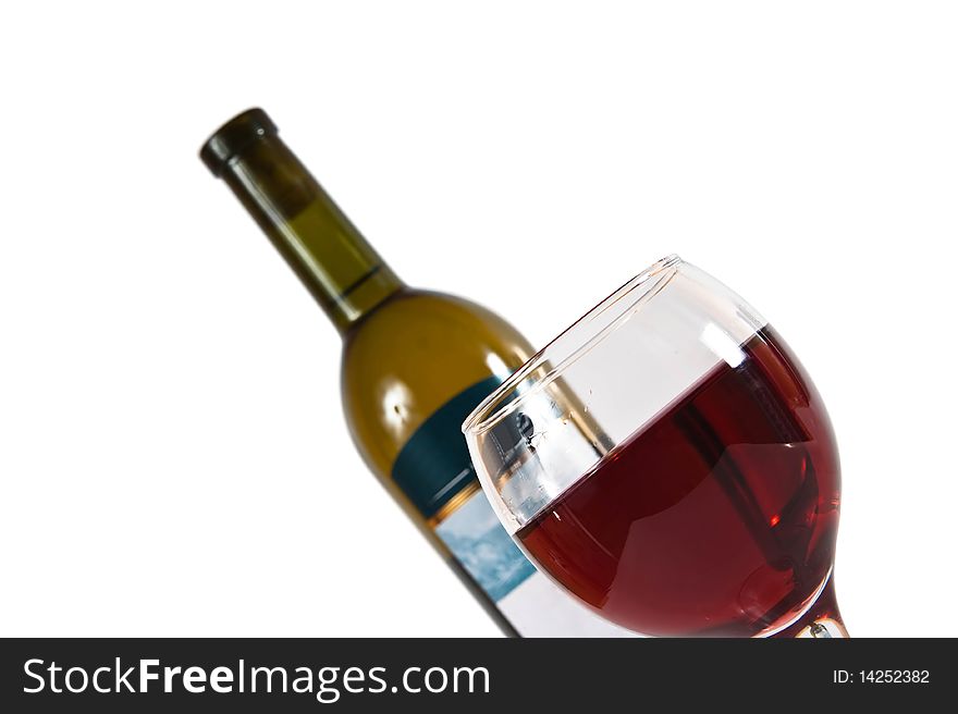 Close up of a Red Wine Bottle with wineglass in front, vertical format over white background