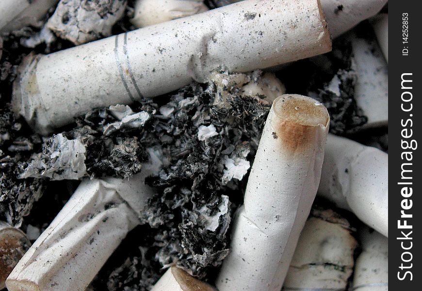 Close-up of ashtray with cigarette butts