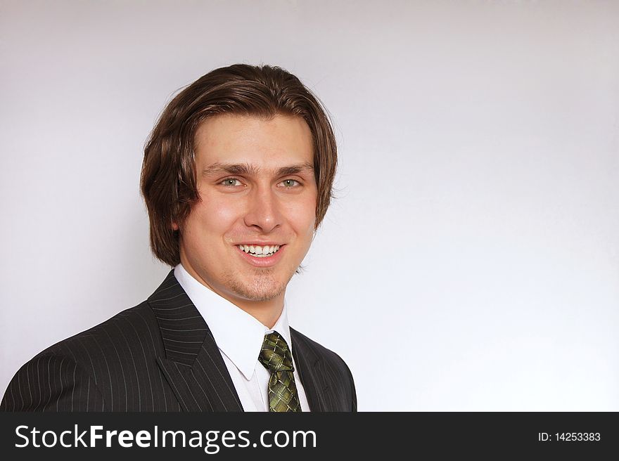 Young businessman in suit with smiling. Young businessman in suit with smiling