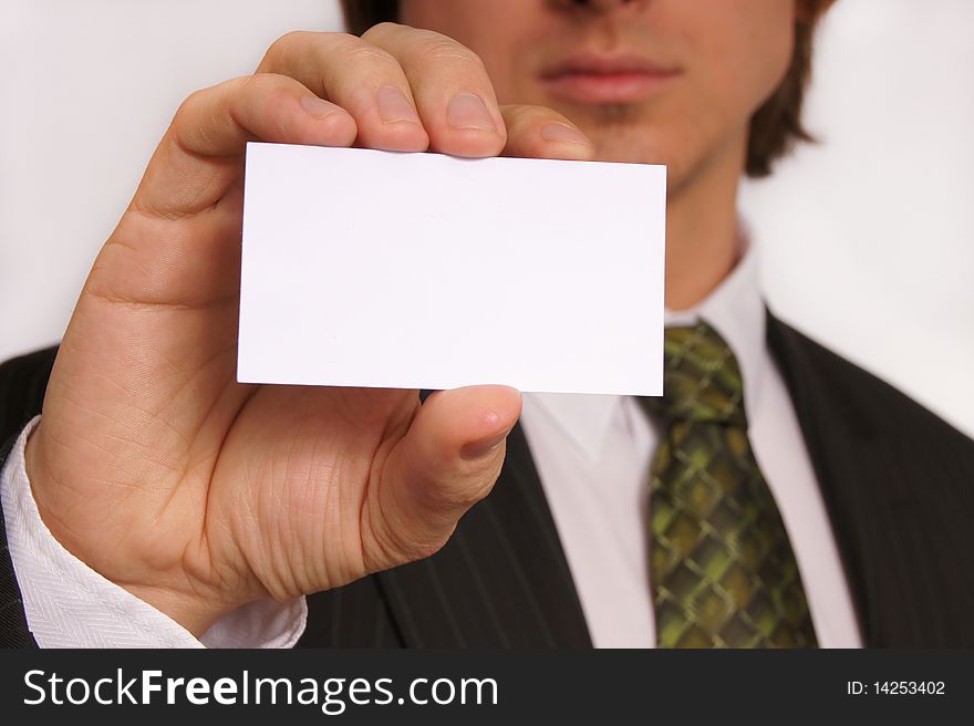 Businessman showing his business card. You can just add your text there. Businessman showing his business card. You can just add your text there.