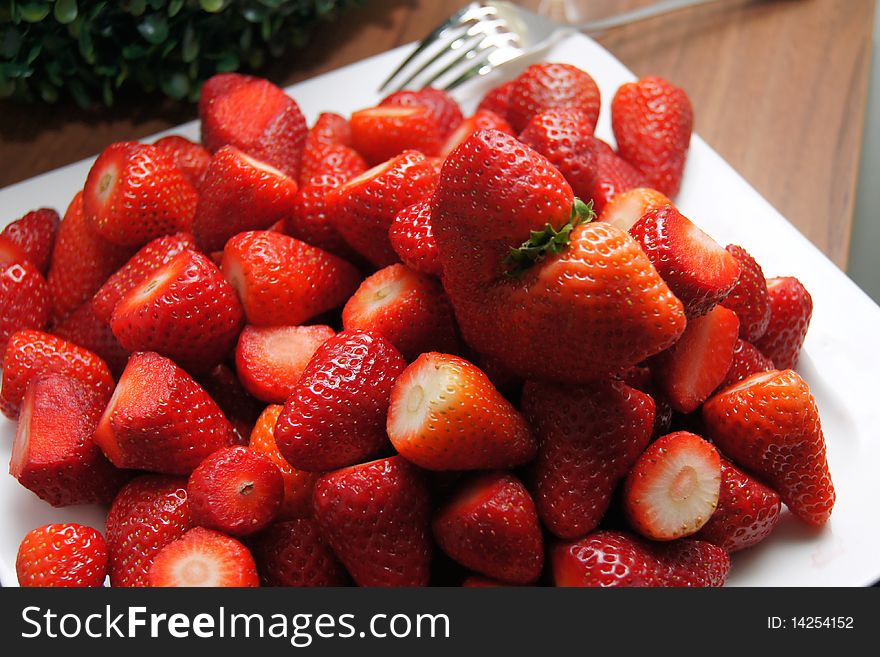 Fresh Strawberries on white plate