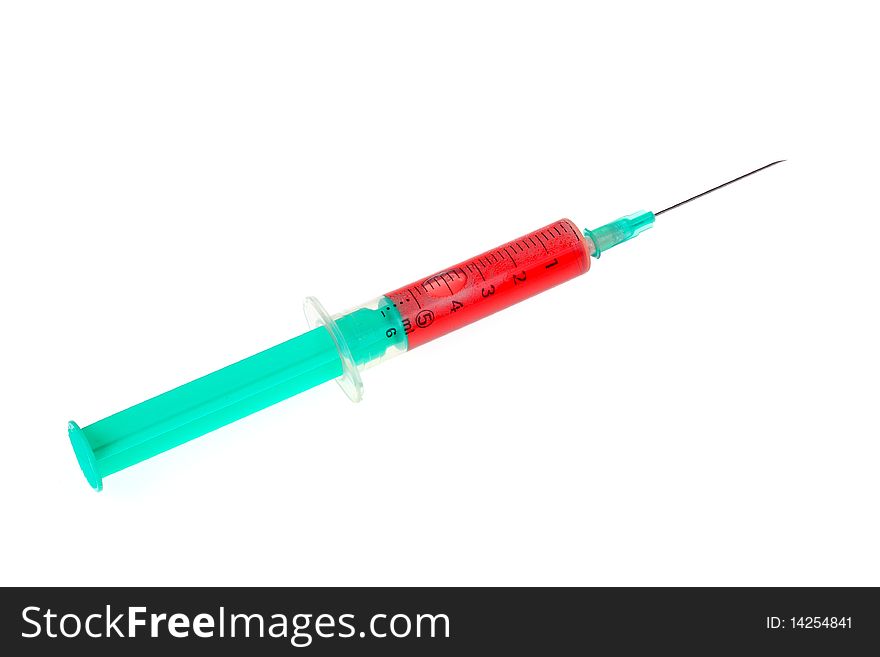 A green syringe with red liquid isolated against white background