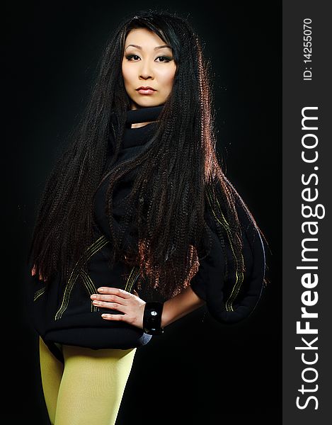 Portrait of beauty brunette asian girl on black background. Portrait of beauty brunette asian girl on black background