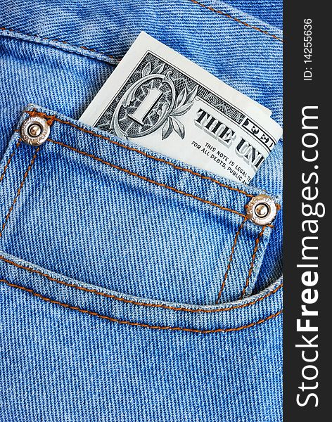 Putting money in the pocket of a blue jeans