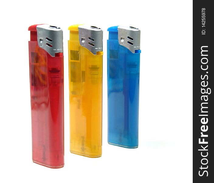 Three colorful lighters on white background