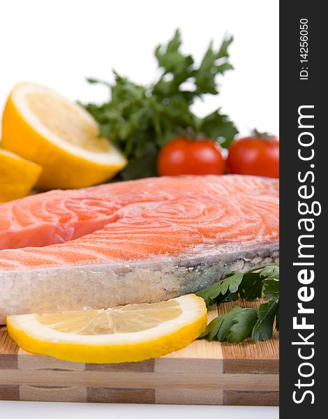 Raw salmon on a wooden board isolated