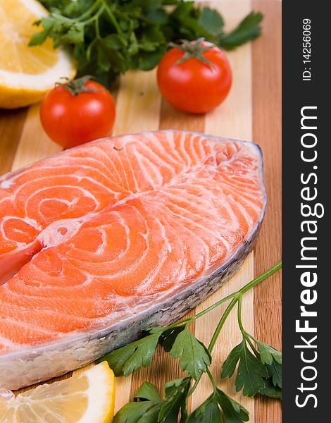 Raw salmon on a wooden board