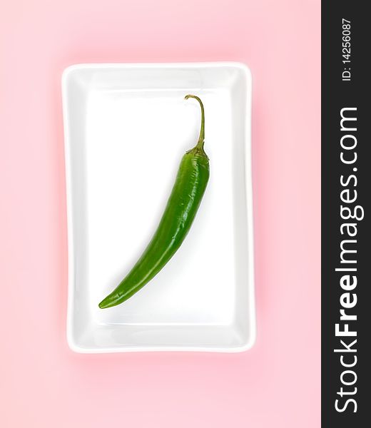 Chilli Peppers isolated on a pink background