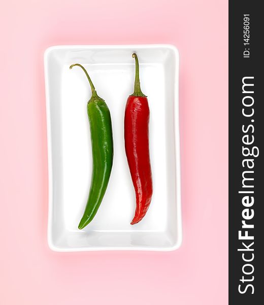 Chilli Peppers isolated on a pink background