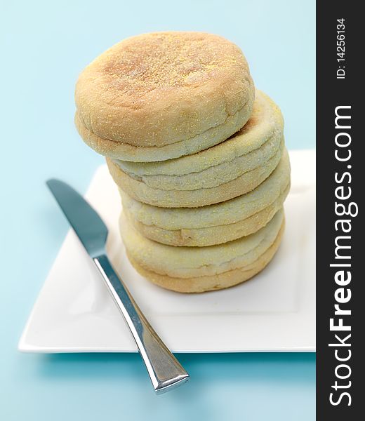 English muffins isolated against a blue background
