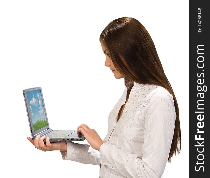 Attractive young woman at work on her laptop computer. Attractive young woman at work on her laptop computer