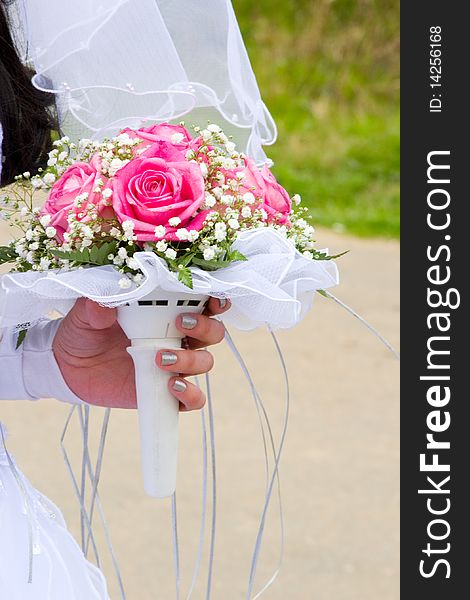 Beautiful bridal bouquet in the hands of the bride